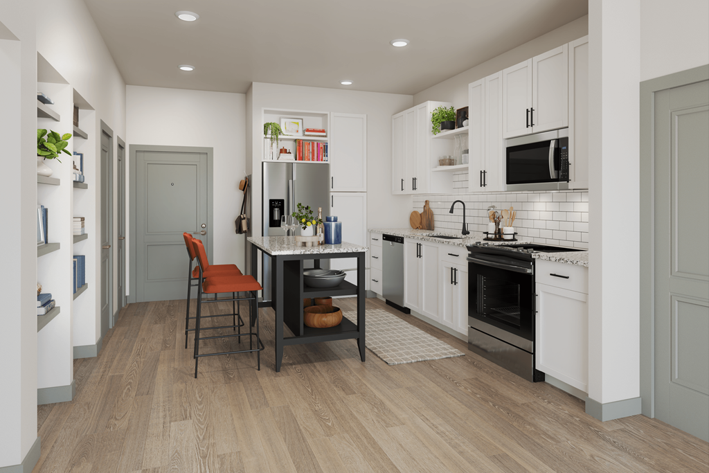 a kitchen with white cabinets and a table with chairs