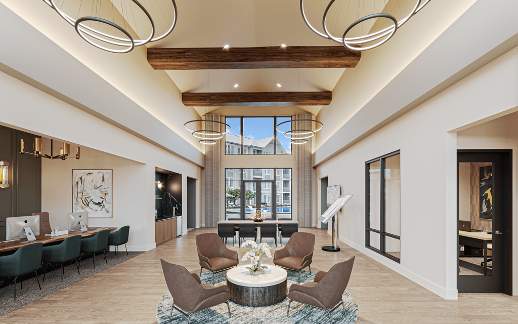 a large lobby with chairs and tables and a large window