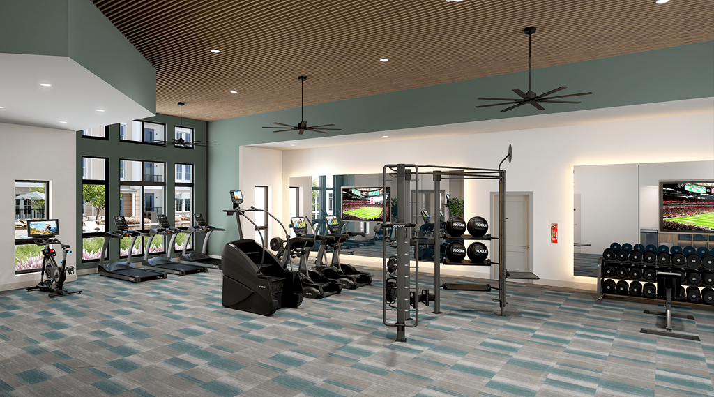 a gym with weights and cardio equipment in a building