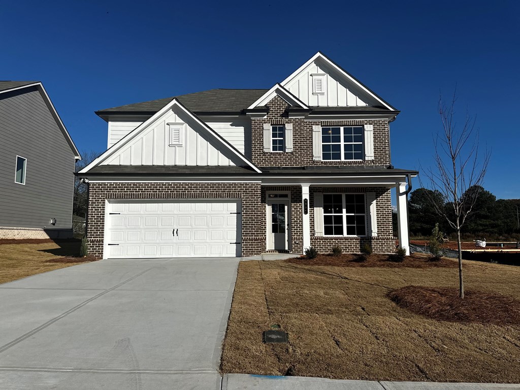 a house with a white garage door in front of it