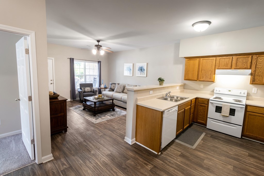 a kitchen and living room in a two bedroom apartment