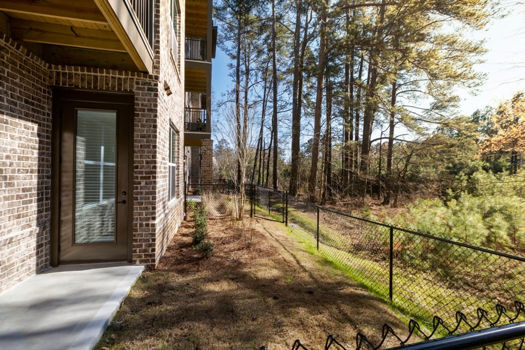 views of the woods from the front porch of a home