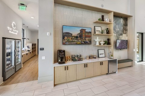 A coffee bar area with a framed picture of a building on the wall.