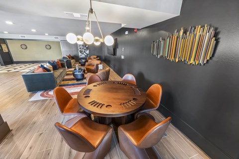 A modern dining room with a wooden table and chairs.