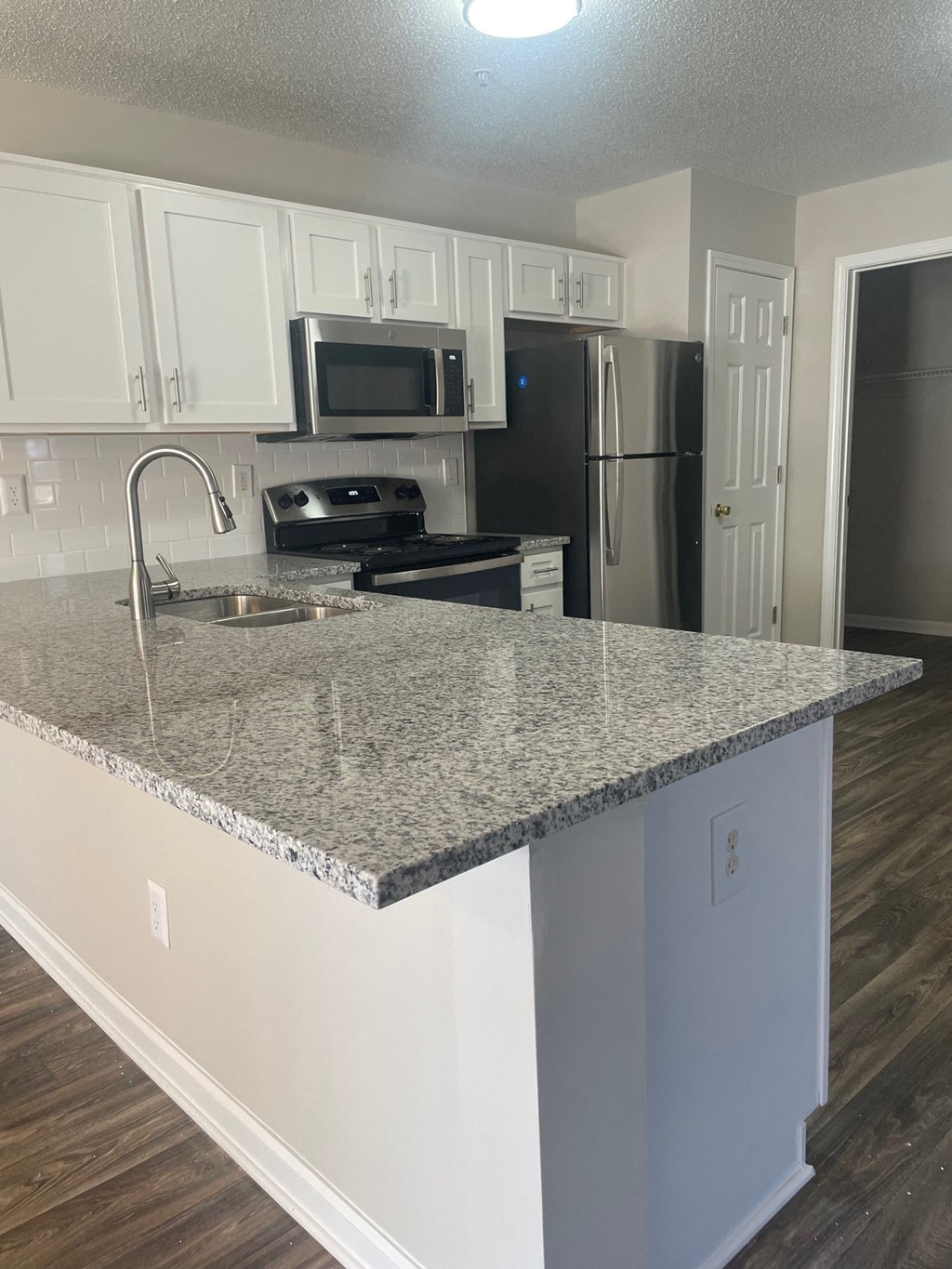 a kitchen with a granite counter top and