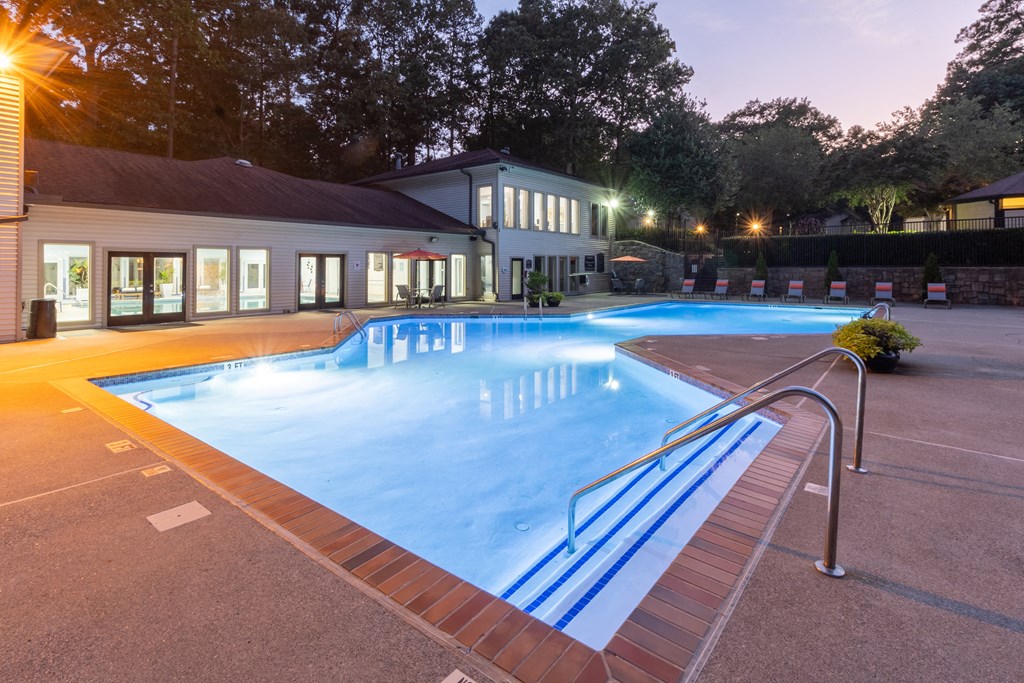 a large swimming pool in front of a building at Seven Pines, Alpharetta, GA