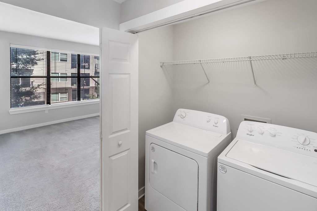 A laundry room with a washer and dryer.