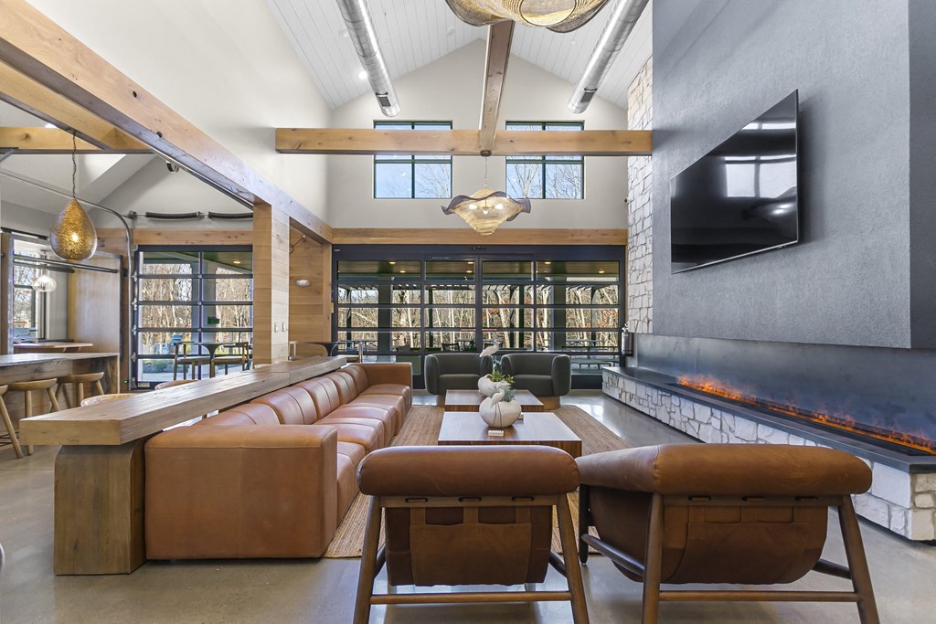 A modern living room with a fireplace and a television.