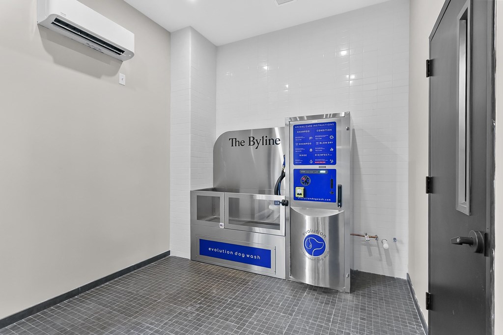 A clean, modern room with a Byline machine in the corner.