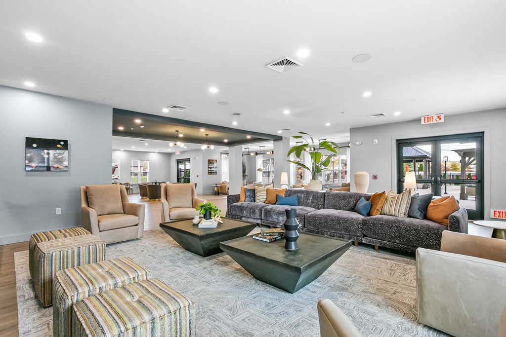 A living room with a grey couch and a coffee table.