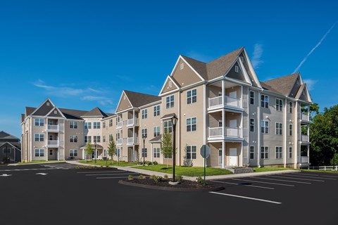 a row of apartment buildings on a city street at Eden & Main 55+ Apartments, Southington ,Connecticut, 06489