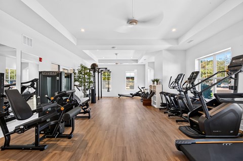 A gym with treadmills and exercise bikes.