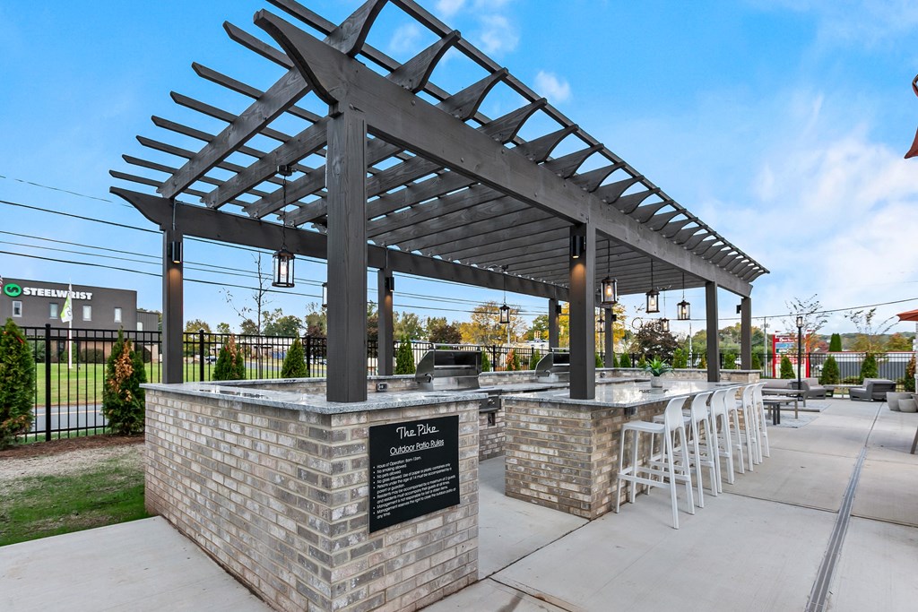A covered patio area with a sign that reads "The Blue.".