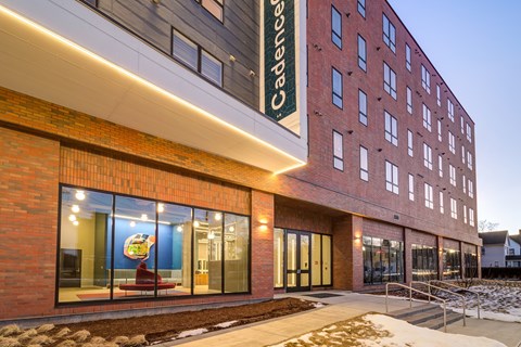 A building with a sign that says "Cadencello" on it.