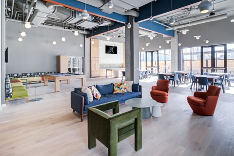A modern office space with a variety of seating options.