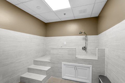 a large white bathroom with a shower and a sink at 1188 Lofts, Bridgeport, 06604