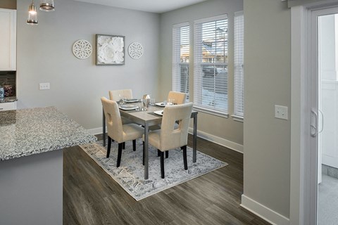 Dining room a dining room with a table and chairs and a window at The Beacon at Gateway Apartments, Scarborough, ME, 04074