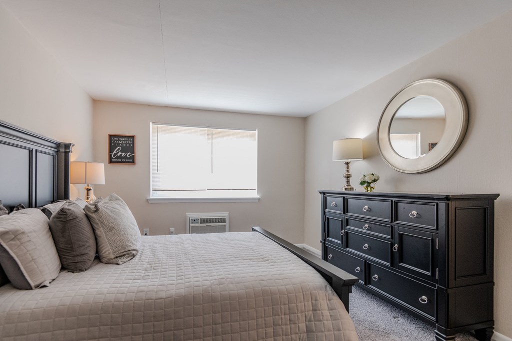 a bedroom with a bed and a dresser and a window at Glen Hollow, Croydon, Pennsylvania
