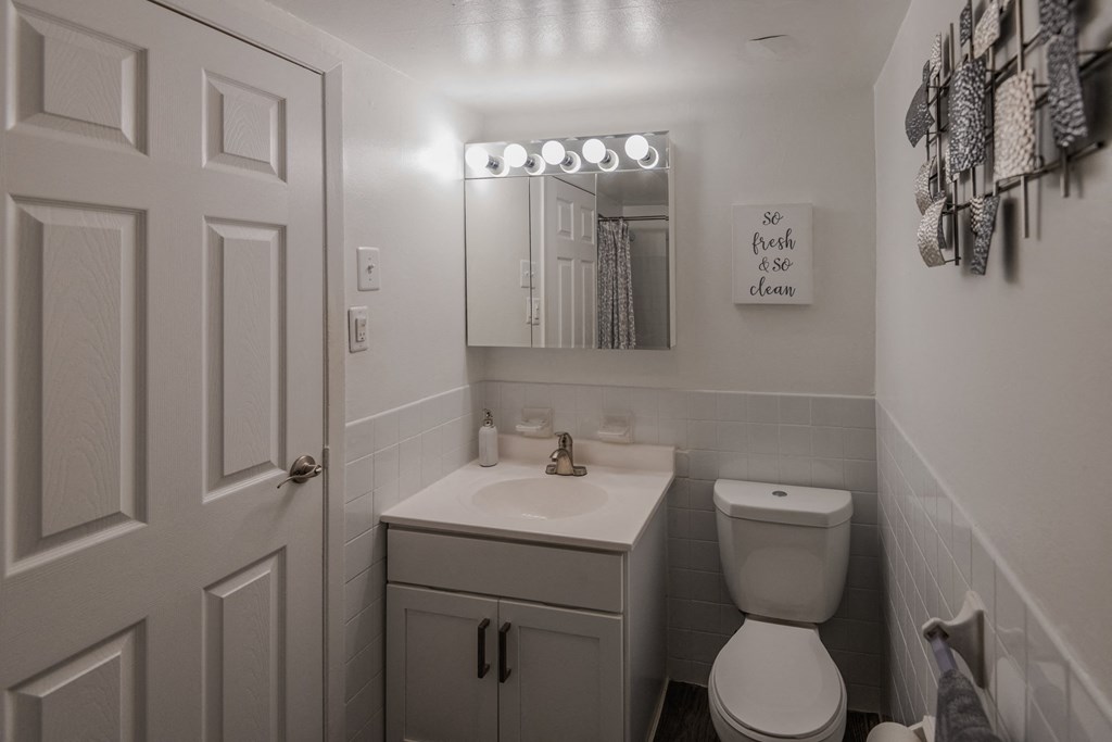 a small bathroom with a toilet and a sink at Glen Hollow, Croydon