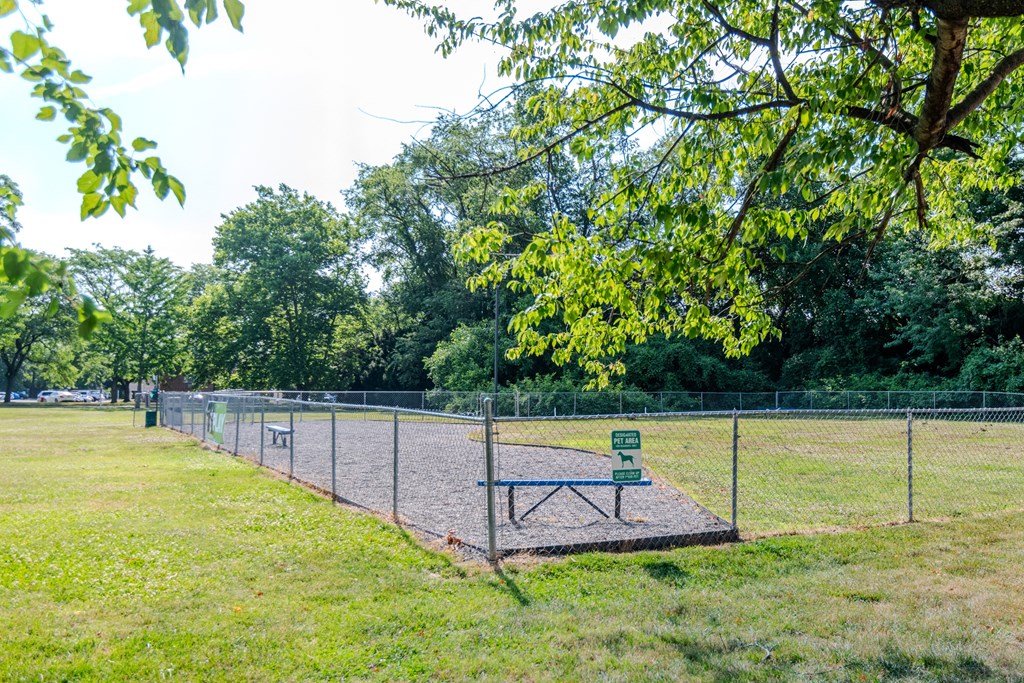 a park bench in front of a chain link fence at Glen Hollow, Croydon, 19021