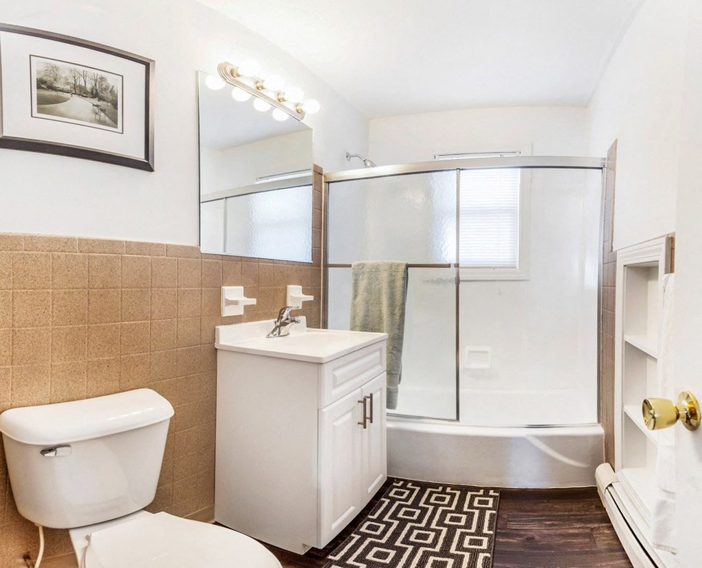 Bathroom with a shower and a toilet and a sink at Griswold Gardens in Glastonbury, CT, 06033