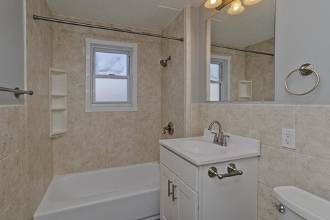 a bathroom with a sink and a tub and a mirror at Laurel Ridge in Northampton, MA, 01060