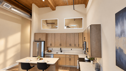 A kitchen with wooden cabinets and a refrigerator.