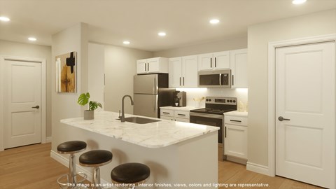 A modern kitchen with white cabinets and a marble countertop.
