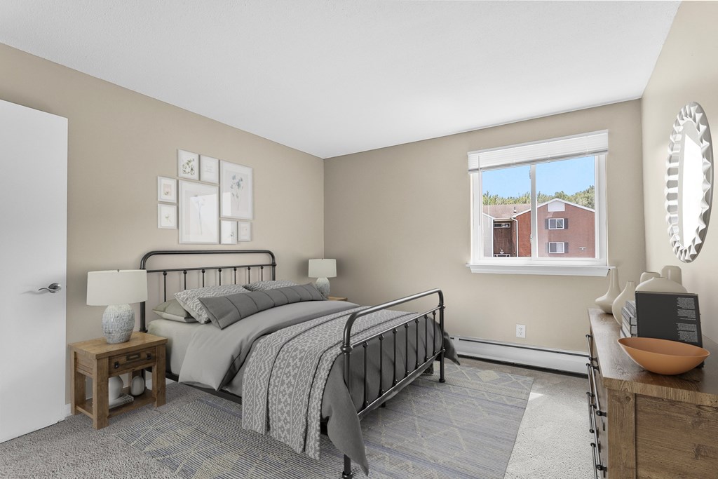 A bedroom with a large bed and a window overlooking a red house at Rose Hill Estates, Norwich, CT, 06360