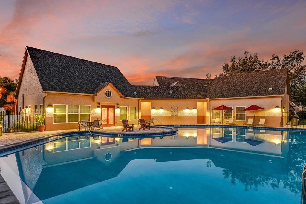 Bloomingdale Woods Apartments Valrico Florida Pool in Foreground with Clubhouse Rear surrounded by sunset