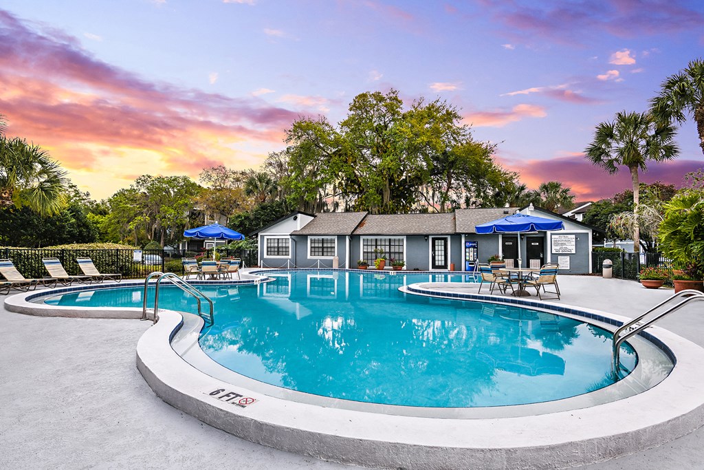 View of Brookside Manor Pool Deck looking towards the Clubhouse with sunset in background