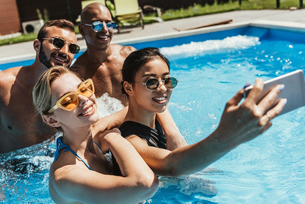 Friends in a pool taking selfie