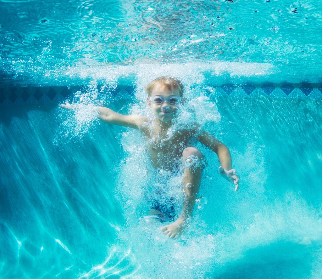 little boy swimming