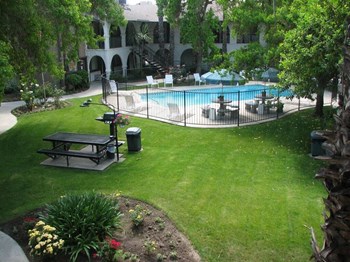 Picnic Area With Grilling Facility Picnic Area With Grilling Facility at Barcelona Apartments, California, 93277 - Photo Gallery 4
