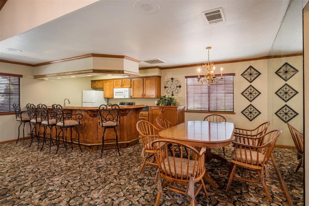 Clubhouse Kitchen Breakfast Bar with Stools at Oxford Park Apartments, Fresno, California