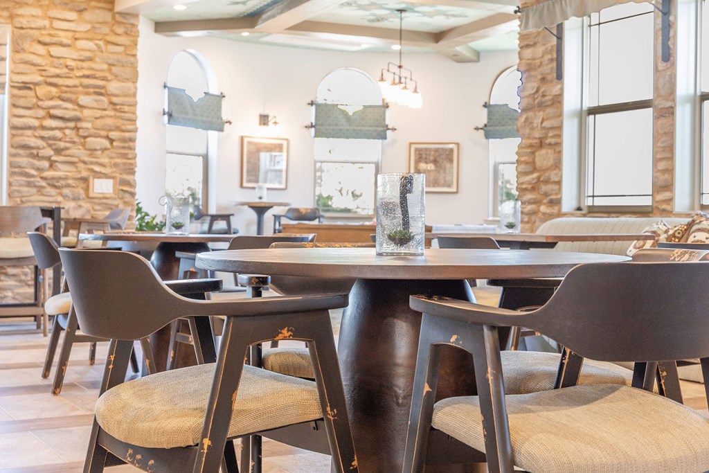 A dining room with a table and chairs.at The Villas at Ellis Manor, Fresno