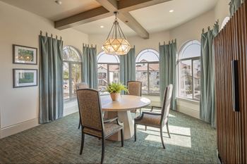 A dining room with a table and chairs.at The Villas at Ellis Manor, Fresno, CA