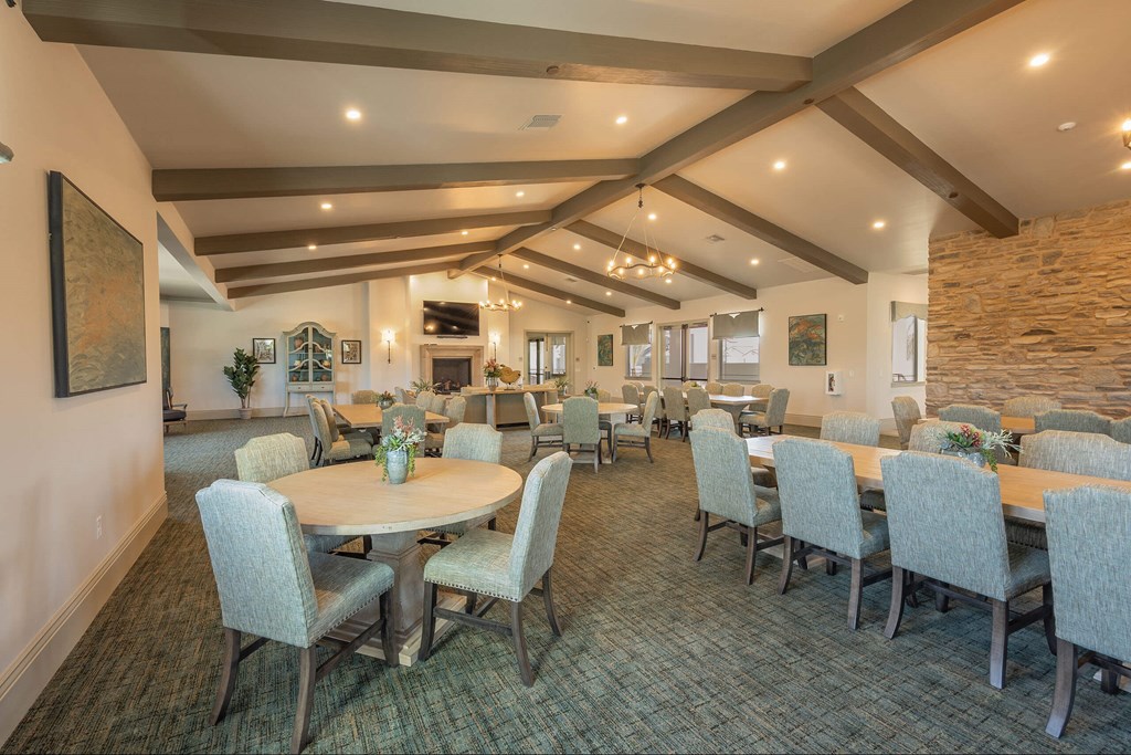 A dining room with a table surrounded by chairs.at The Villas at Ellis Manor, Fresno, CA 93720