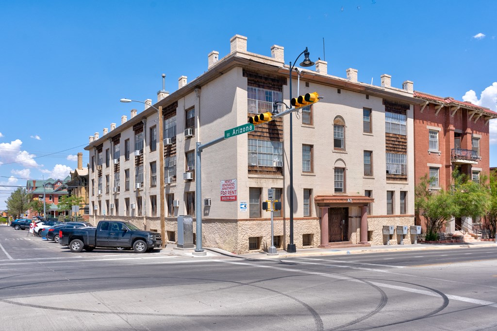 A street view of a building with a sign that says "Avenue".