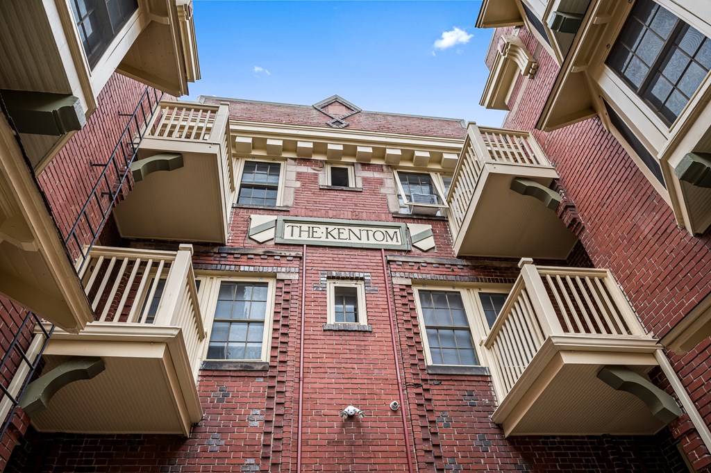 a red brick building with a sign that reads