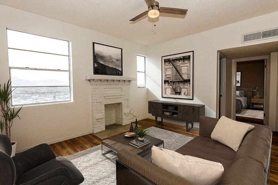 a living room with a couch and a fireplace
