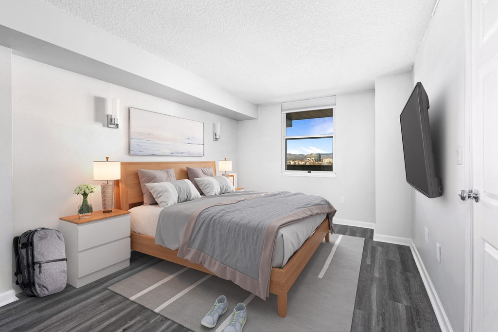 a bedroom with a bed and a window