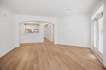 A room with wooden floors and white walls.