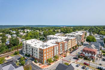 A large apartment complex sits in the middle of a town.