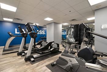 A gym with a blue wall that says