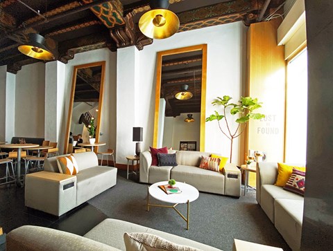 A living room with a white couch and a coffee table.