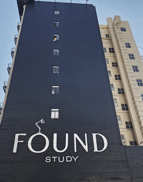 A tall building with the words "FOUND STUDY" on it.