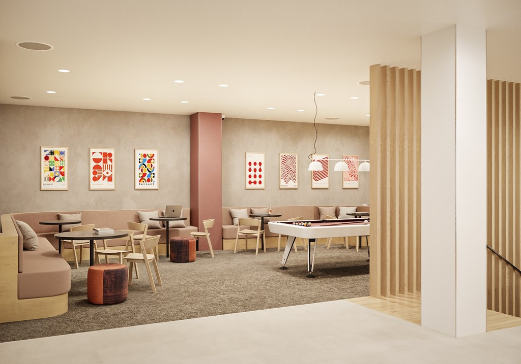 A modern dining area with a long table and chairs.