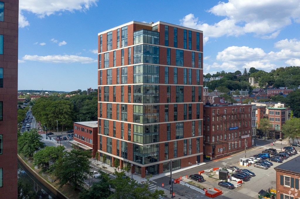 an aerial view of a tall building in a city