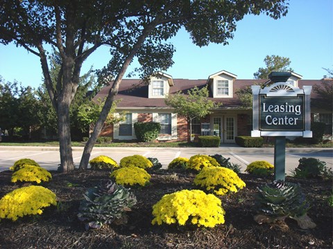 the leasing center sign in front of a leasing center building